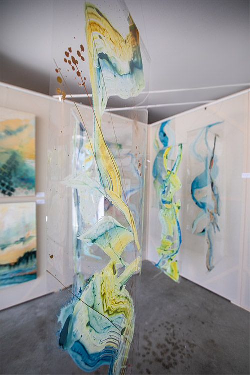Installation of Jan's paintings on acetate panels